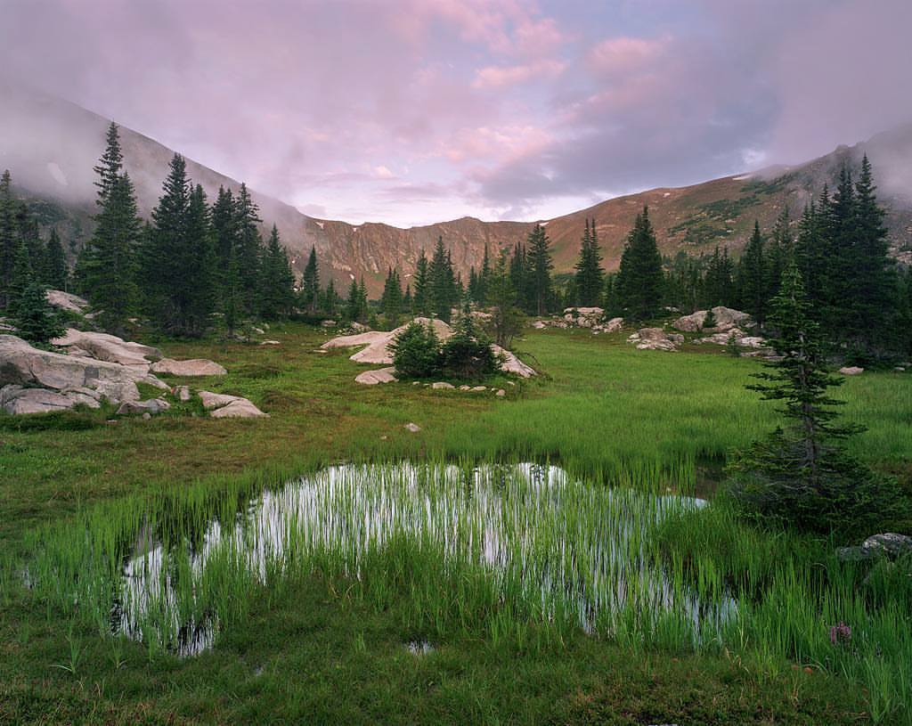 alexburkephoto: A moody sunrise in the backcountry as clouds hang low around the