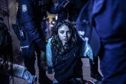 riggu:  1st place of World Press 2015. Girl wounded during clashes between riot police and protestors, Istanbul, March 12. Riot police fired tear gas and water cannon at protestors in the capital Ankara, while in Istanbul, crowds shouting anti-government