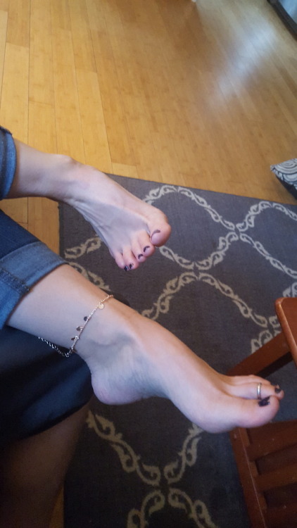 My pretty wifes beautiful feet in my lap getting some rubs.please comment