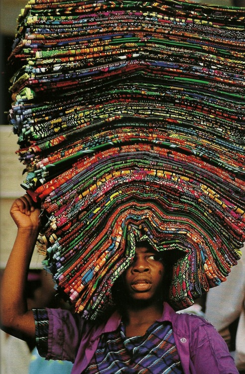 vintagenatgeographic:  A vendor peddling wax prints in Lome, Togo National Geographic | June 1994