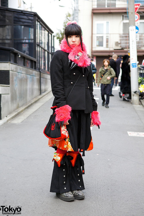 Japanese programmer Ikumi on the street in Harajuku with pink hair falls and fashion by Takuya Angel