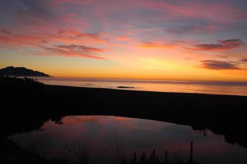 Sunrise at Kaikoura beachThis photo was taken in summer of 2006 at Kaikoura, a town on the eastern c