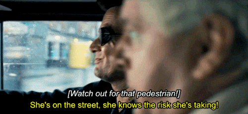 Crowley and Aziraphale driving in the Bentley. Aziraphale cries: "Watch out for the pedestrian!" and Crowly replies with: "She's on the street, she knows the risk she's taking!"