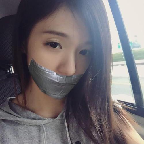 Asian girl fake tape gagged