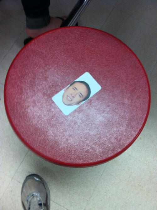 hiddlestalker:  hiddlestalker:  Someone at my school has been putting Nicolas Cage’s face stickers all over the school cafeteria  buT GUYS  HE’S EVERYWHERE  