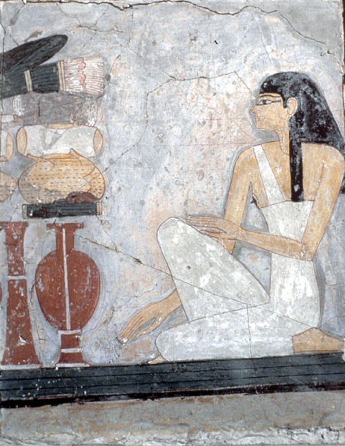 18th dynasty Egyptian mural of a woman kneeling before an offering table, 18th circa 1450 B.C. 