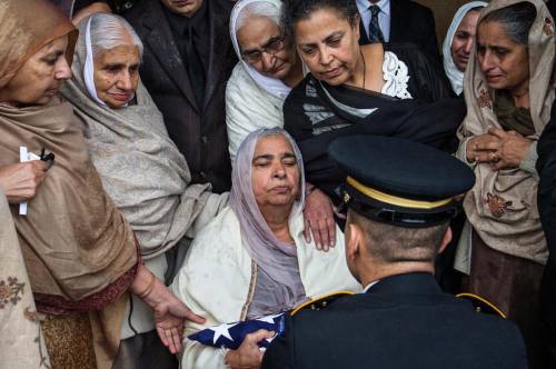 For Mothers Day: A military honor guard presents Sukhwinder Kaur with the American flag that had dra