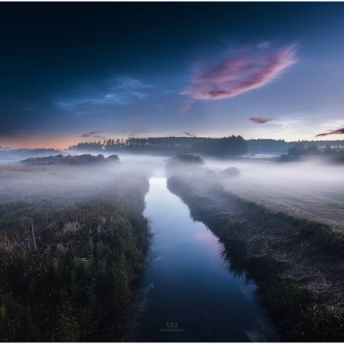 A Northern Summer’s Night   Image Credit & License: Ruslan Merzlyakov (RMS Photography)  Explanation: Near a summer’s midnight a mist haunts the river bank in this dreamlike skyscape taken on July 3rd from northern Denmark. Reddened light