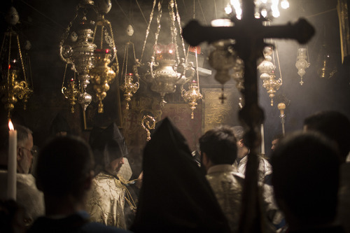 Armenian Patriarch of Jerusalem, Nourhan Manougian, leads the Vespers, evening prayers, in the Grott