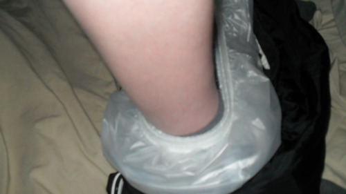 Wet diapers in my plastic pants round my ankles then just plastic pants ready to be pulled up over m