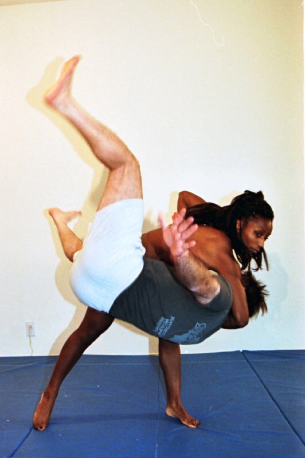 decreathe:  See his hand, stresses how helpless he is against her wrestling skillsâ€¦