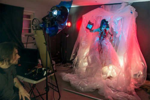 kassandraphoto:  I couldnt help but add a lil BTS shot at the end! This shoot I did with my friend Nan Valtiel was a great ‘getting back to our roots’ party. We used nothing but tarp, tape and fake blood to create images that feel like they are ripping