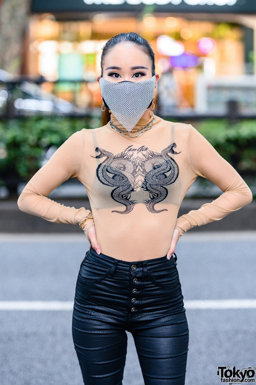 Japanese nurse Saya on the street in Harajuku wearing a chainmail face mask with a sheer top by I.Am
