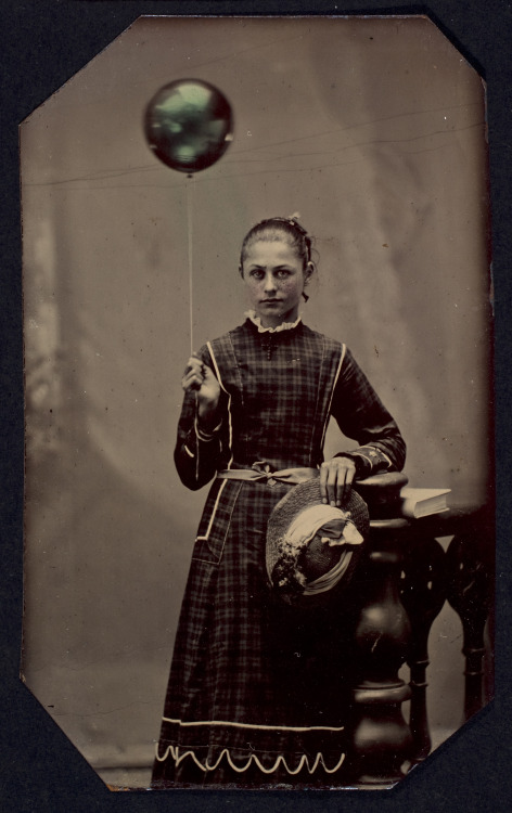eastmanhouse:Young woman holding hydrogen-filled balloon Unidentified ca. 1890 tintype with applie
