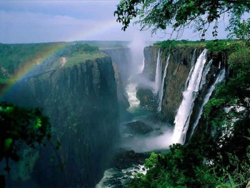 sixpenceee:  Victoria Falls lies on the border of Zambia and Zimbabwe. It’s the largest waterfall in the world. 