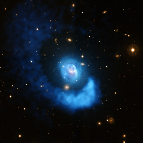 Abell 2052, a sloshing spiral, with bubbles of x-ray emission from the active galactic nuclei, drive