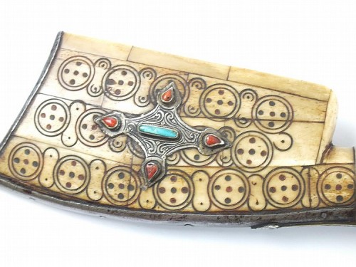 A North African snaphaunce musket mounted with ivory and decorated with silver, turquoise, and red c