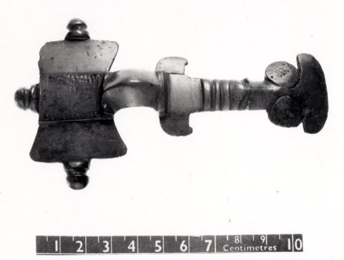 Early Anglo-Saxon cast copper alloy cruciform brooch (c. 475 –550), found in the cemetery sandpit at