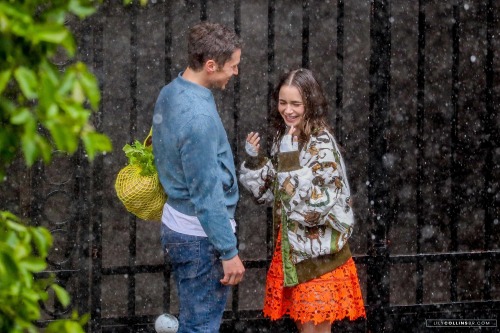  Lily Collins and Lucas Bravo were filming under fake rain Emily In Paris, in Paris today, May 19th.