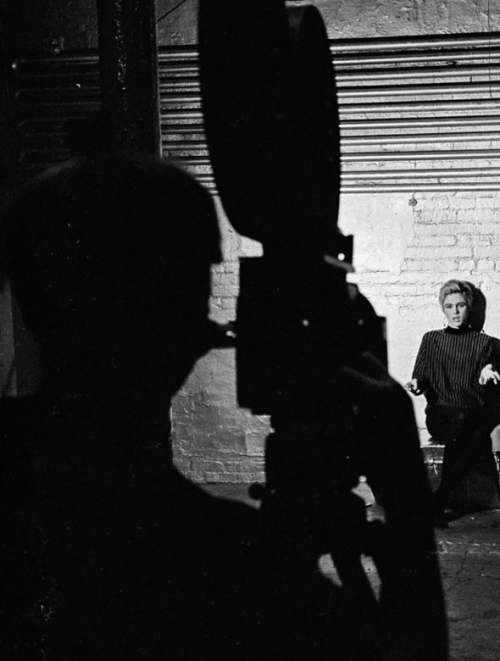 ff7417:Cropped photograph of Andy Warhol filming Edie Sedgwick by Bob Adelman 