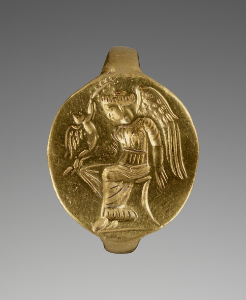 didoofcarthage:Gold ring with image of a winged woman, perhaps Aphrodite, with Eros Greek, Clas