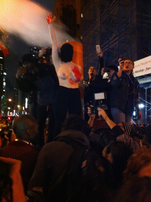 daughterofwands:  WHERE WILL YOU BE FOR THE REVOLUTION?Young Woman Covers Her Face & Presents Her Red Smeared Body, While Placing Her Hand Over Heart, In Solidarity To Her Fellow Sisters - To Her Fellow Americans. There She Stood  Amongst The Chants