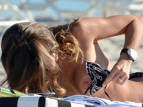 toplessbeachcelebs:  Claudia Galanti (Italian Model) sunbathing topless in Miami (December 2012) 