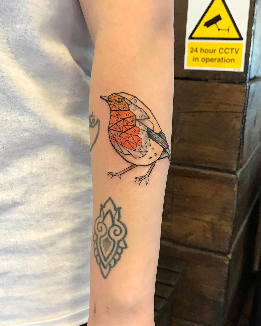 Small Robin Bird Tattoo Design