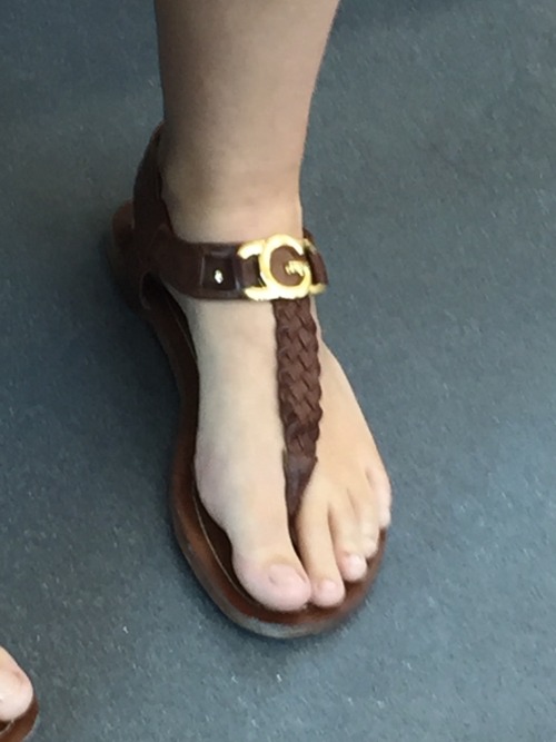 Love those sandals but somebody buy her a pedicure.