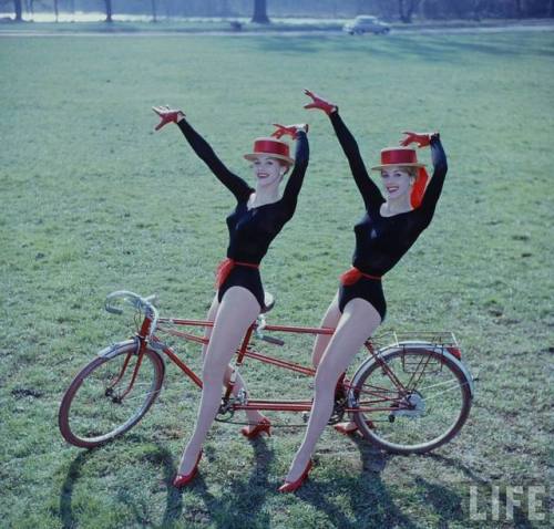 Alice and Ellen Kessler on a bicycle(Loomis Dean. 1963?)