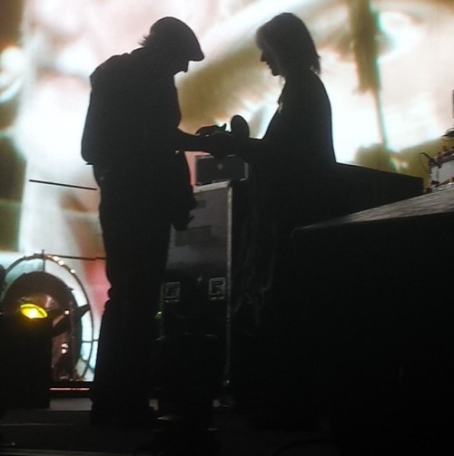 John and Chris holding hands in the dark, 2014