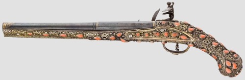 Turkish flintlock pistol mounted with gilded silver and red coral, early 19th century.from Hermann H