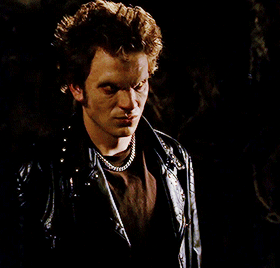[GIF description: a GIFset from Buffy the Vampire Slayer. Dawn is chained up in front of a sneering 