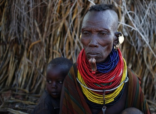 Turkana adornments part 2:1. A woman and child in Napak village. Photograph: Goran Tomasevic/Reuters