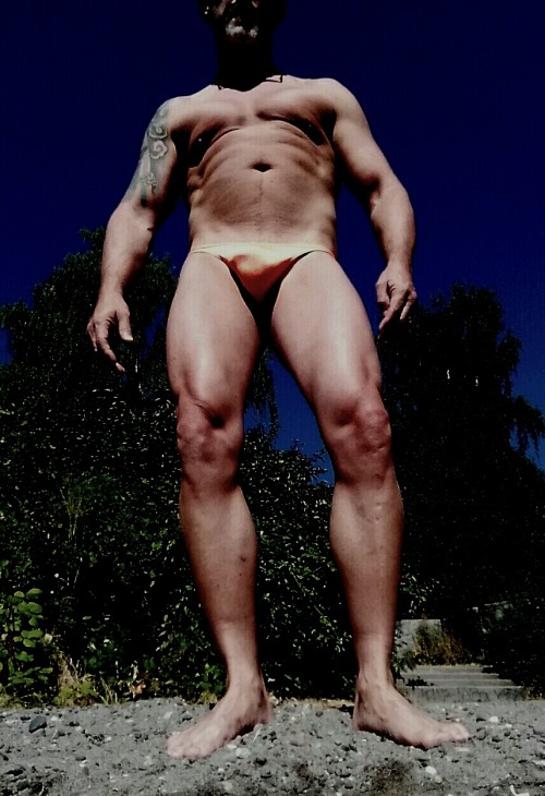 thong-jock:  Flexing at the beach in my ½" orange classic pouch muscleskins thong. Denny Blaine Beach seattle. 