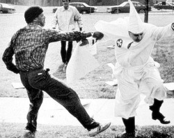 ihateaynrand:The KKK taking a beating.Confrontational antifascism is and always will be self-defence.