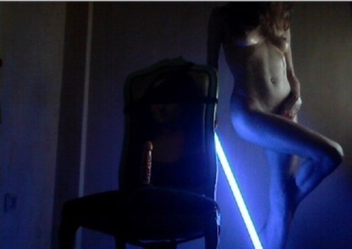 lady-war-of-the-ring-stars:  Hey you, I sent a submission a while back (I had a different blog then) and promised I’d be back, so here I am, naked and wielding a lightsaber! Please ignore the phallic shape on the chair, that’s a different story! Thanks,