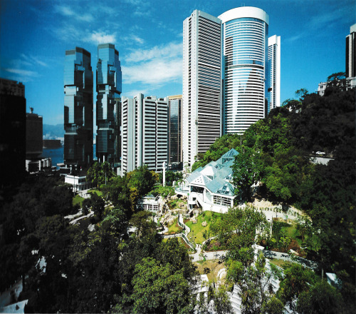 80sretroelectro:  View of Hong Kong Park with Pacific Place (right) and Lippo Centre (left) in the background. Designed by Wong Tung &amp; Partners Ltd, completed in 1991. Commissioned by the Urban Council of Hong Kong, designed in 1984.Scan 5