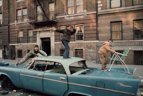vintageeveryday:  Children hang out on an abandoned car in the Bronx, 1970.