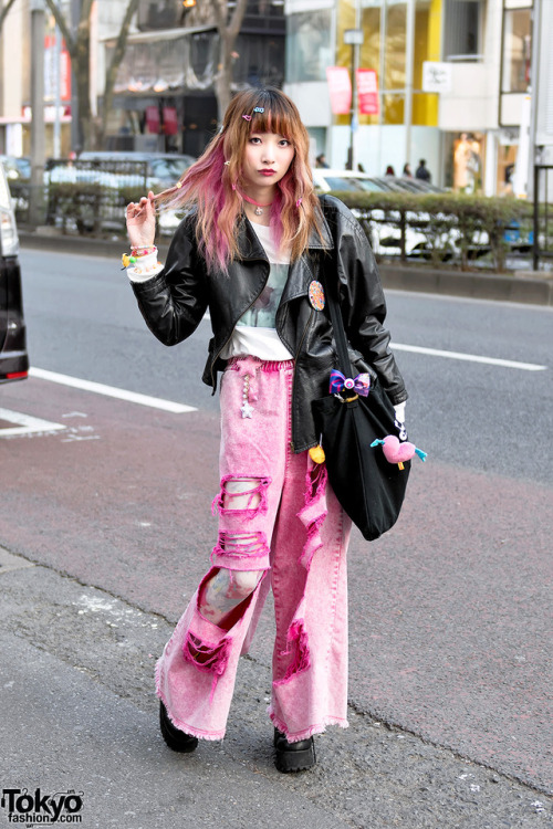 Sakura Pluto on the street in Harajuku wearing a biker jacket over Bubbles tee, ripped pink Candy St