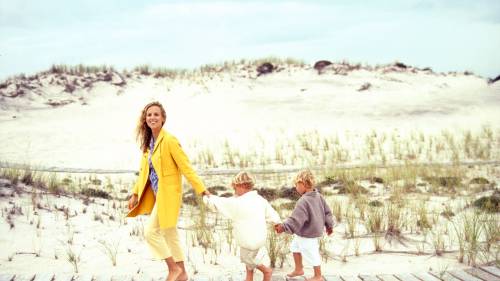 Tory Burch leads her sons by her Southampton home, 2001Photographer: Arthur Elgort (American; b. 194