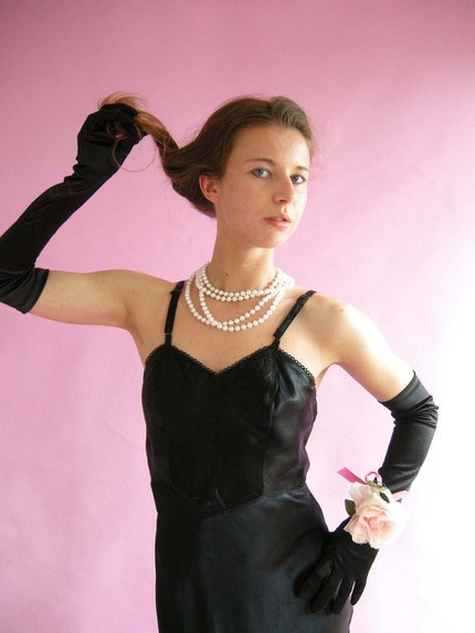 There’s something very sexy about a woman wearing a black satin slip and matching satin opera 