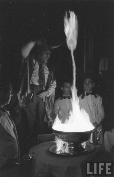 Flaming punch bowl sorcery (John Dominis. 1951)