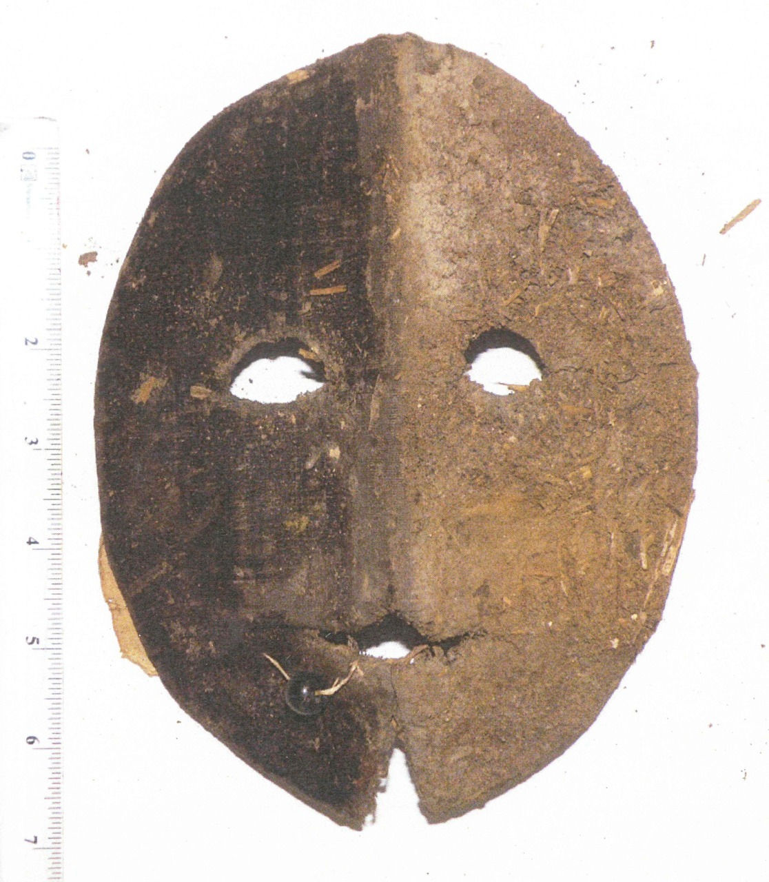erikkwakkel:  Spooky mask discovered in wall This object is not a book, but it’s