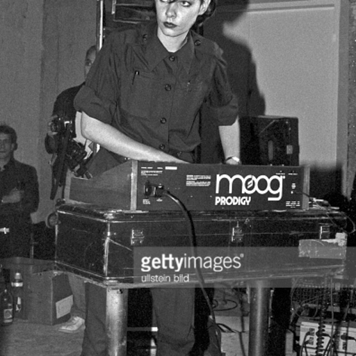 kaltsektion:  	1980 by Chris Carter  	Cosey working in the Industrial Records office at Beck Road, Hackney in 1980. An Abba poster can be seen on the wall, above a TG flyer.  