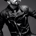 leatherarmysport:#LeatherArmySport  A leathered-up handsome robocop prepares himself