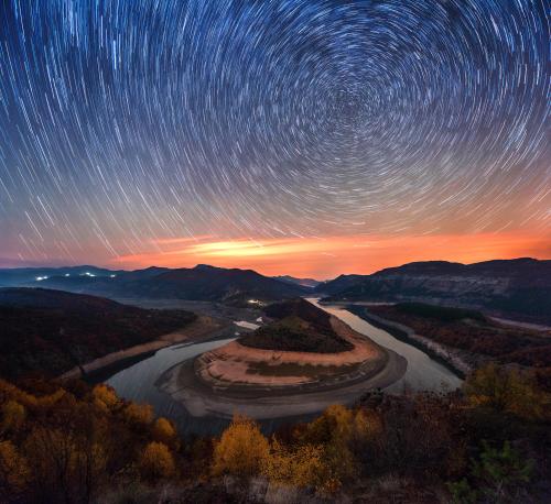 oneshotolive:  Arda river meander, Bulgaria. Panoramic photo for the ground + star trail stack of multiple shots for the sky. [OC][4500x4119] 📷: russasanov 