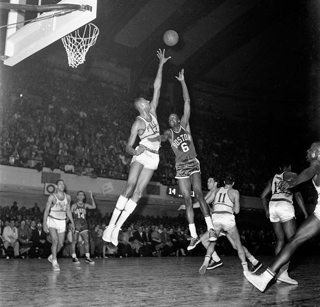 siphotos:  Boston Celtics center Bill Russell shoots over the reach of Philadelphia