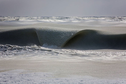 sixpenceee: Freezing Ocean Waves In Nantucket Are Rolling In As Slush   It’s so cold that the sea on the coast of Nantucket, an island on the eastern coast of the U.S., has turned into slush! Jonathan Nimerfroh, a photographer and surfer who’s “obsessed”