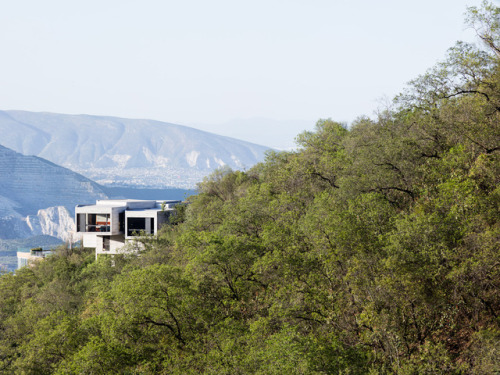 archatlas:  Ventura House in MonterreyThis house by Mexican architect Tatiana Bilbao comprises a cluster of five-sided concrete blocks that emerge from a forested hillside to offer panoramic views towards the city of Monterrey. The uneven terrain informed